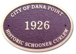 Oval City of Dana Point plaque reading “1926 Historic Schooner Curlew”